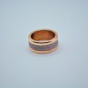 rose gold colored modular ring with shiny metallic inner band